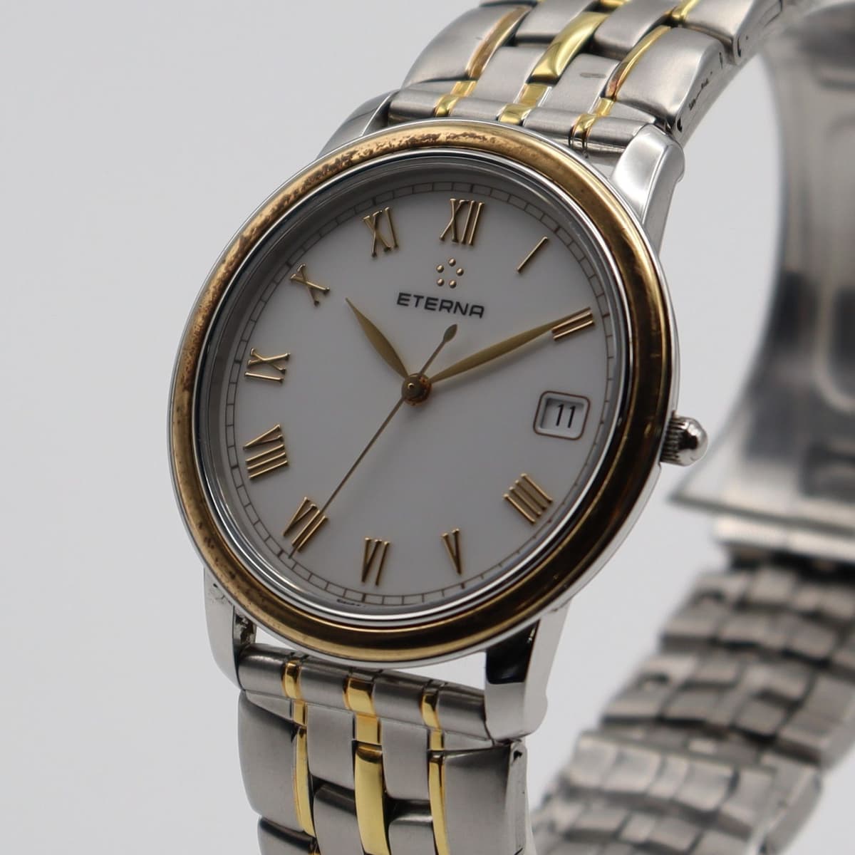 Eterna 3105.47 Quartz Mens Watch 18K Bezel White Dial Date Stainless
