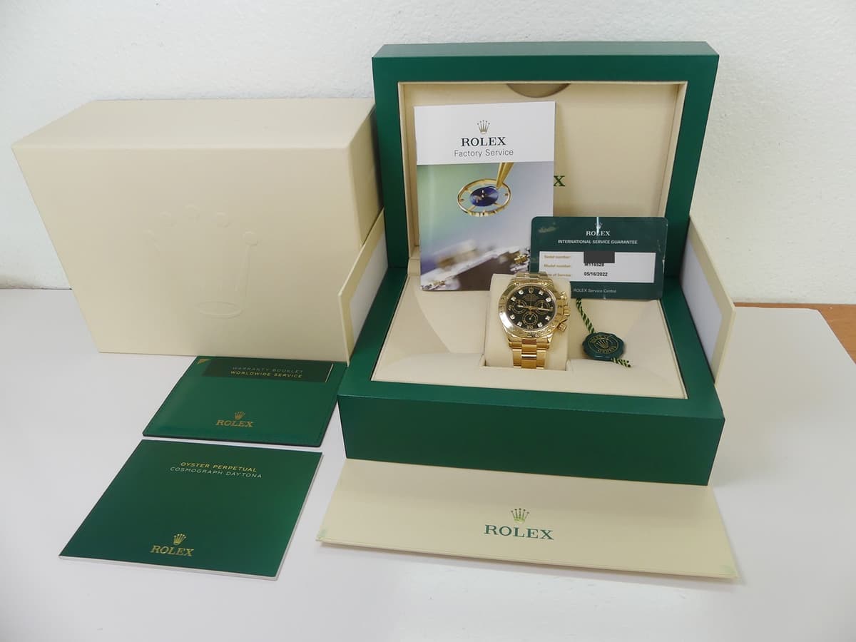 Rolex 18k yellow gold Daytona black diamond dial 116528 with box/service card