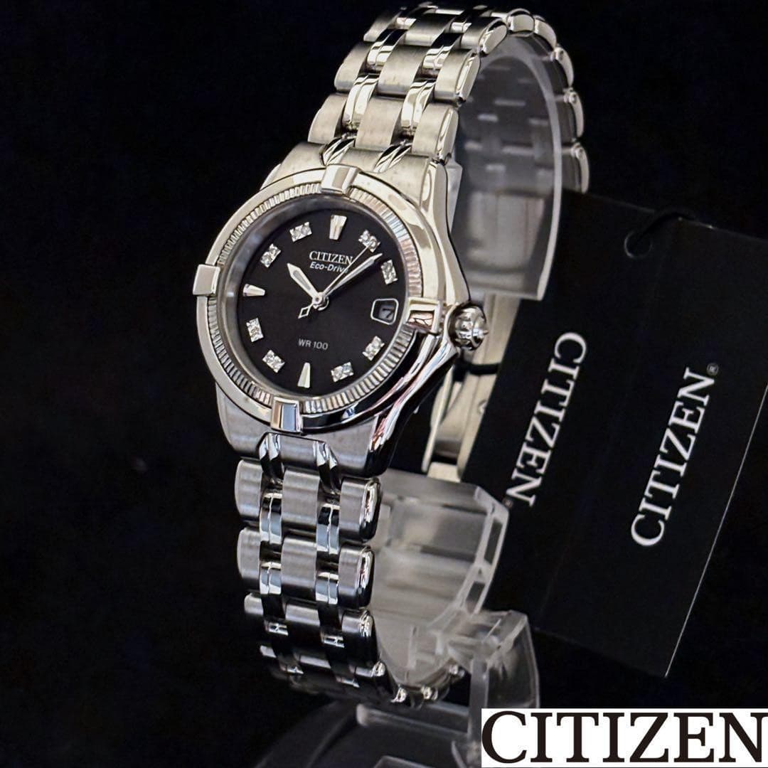 Elegant CITIZEN ladies, black dial, diamond accents, Eco-Drive, 100m resistant.