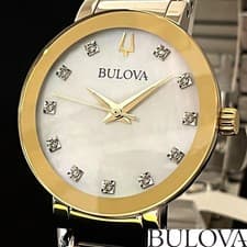 BULOVA mother-of-pearl diamond watch. Elegant two-tone design, feminine style.