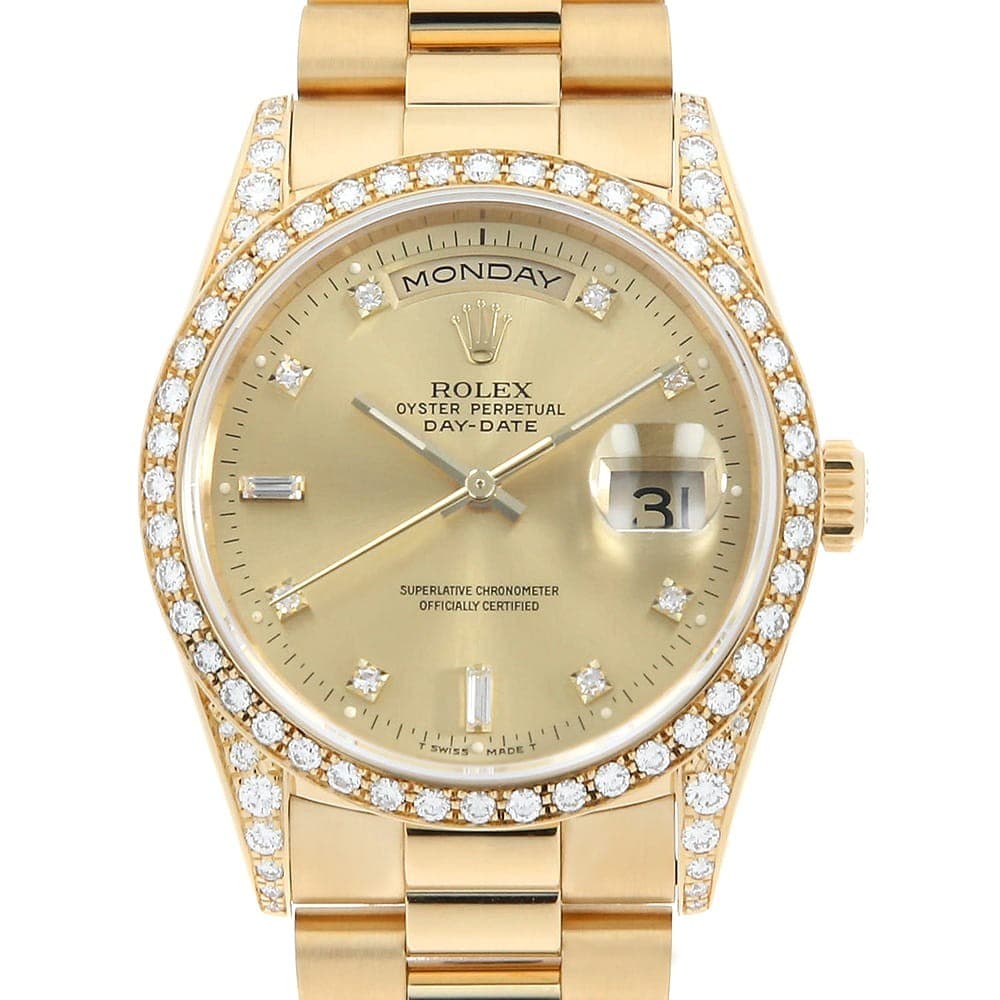 ROLEX Day-Date with diamond bezel and lugs, 8 diamonds, and 2 baguette diamo...