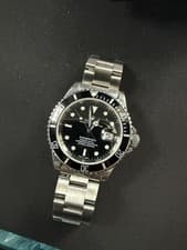 Rolex Submariner 16610 Silver Oyster Bracelet with Black Bezel A Serial Date Sub
