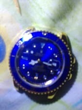 rolex submariner watch (blue and gold) used condition, is missing wrist band.